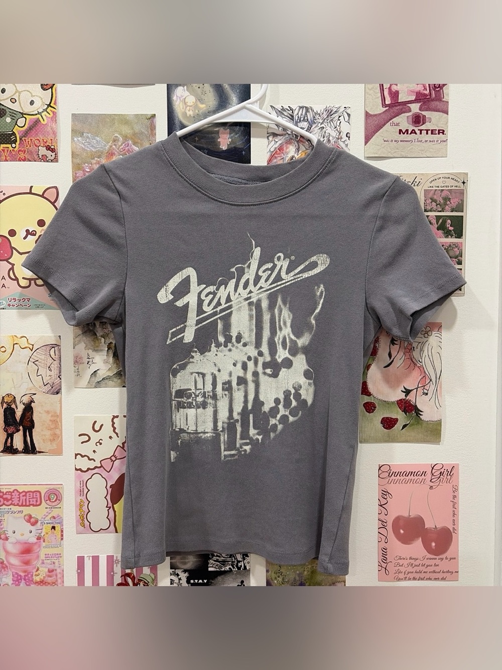 gray baby tee with “fender” logo